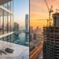 Split concept of completed Dubai luxury apartment interior with keys on marble table beside high-tech skyscraper under construction at sunrise