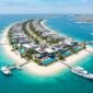 Spectacular aerial view of Palm Jebel Ali frond featuring ultra-luxury modern beachfront villas and crystal waters