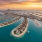 Aerial view of Palm Jebel Ali archipelago by Nakheel with luxury beachfront mansions, turquoise lagoons, and private beaches at sunset