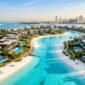Luxury Dubai villas with private pools and white sand crystal lagoon overlooking modern skyline